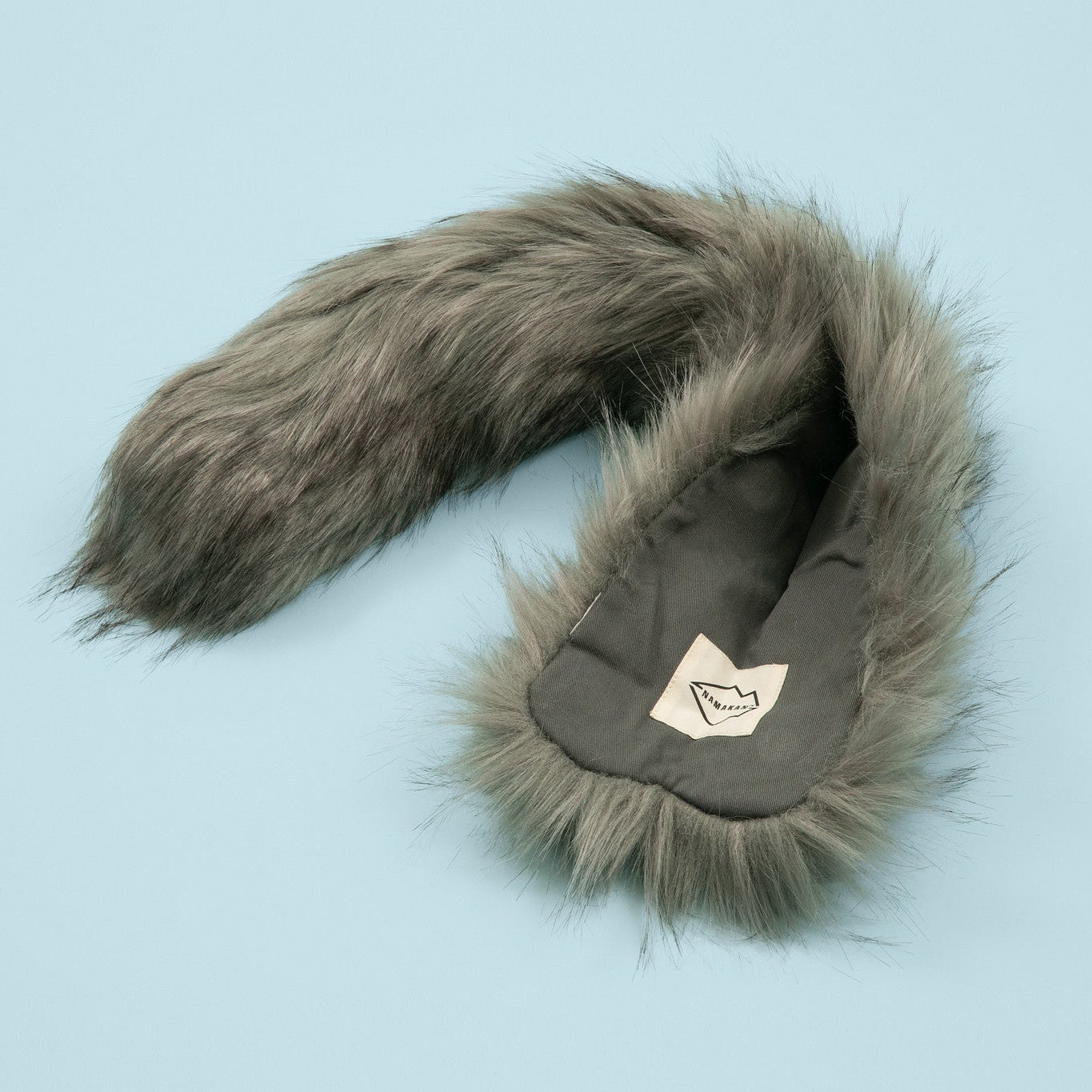 Faux fur-lined hood with a logo on a light blue background