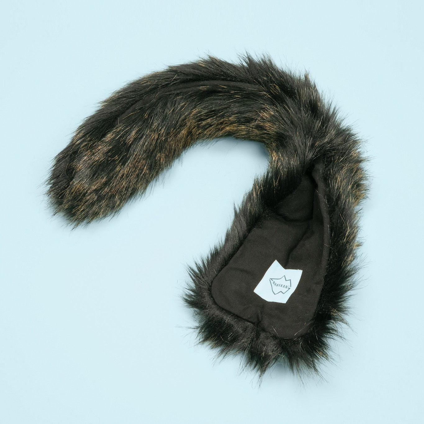 Faux fur hood trim with a logo on a light blue background