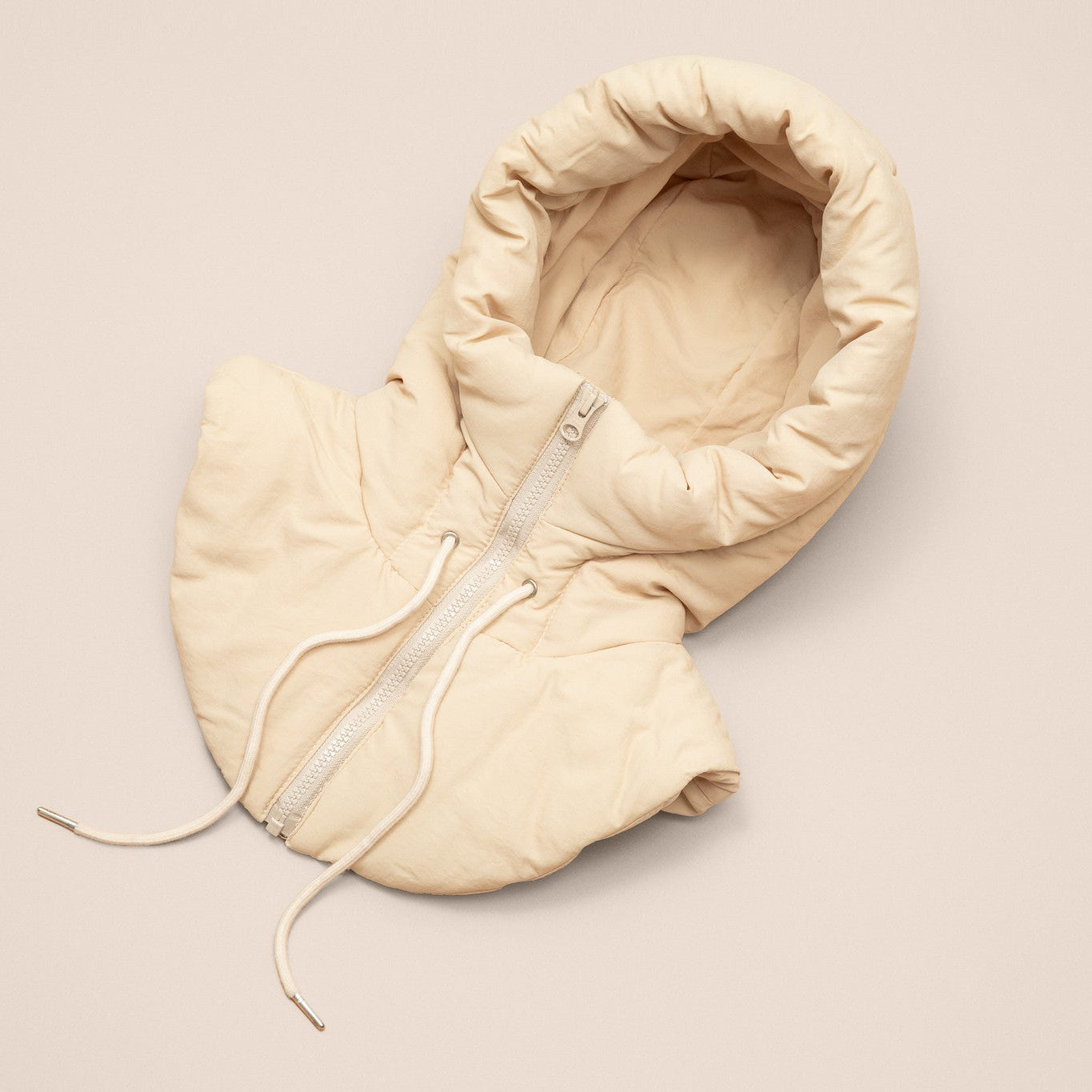 Beige puffer hood on a beige background